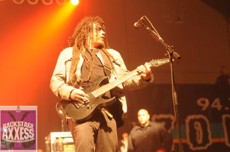Singer singing with his guitar in Korn Rochester armory