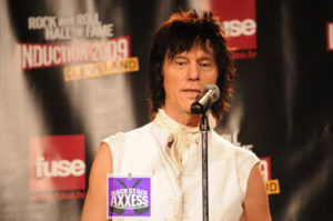 Jeff Beck giving a speech shown in the picture